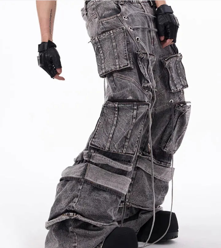 Grey distressed cotton denim mop pants with rope stitching, shown in a relaxed fit.