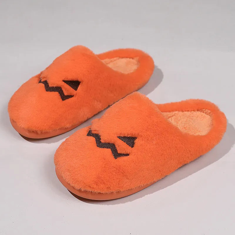 Orange Halloween pumpkin slippers with plush lining and textured PVC sole.