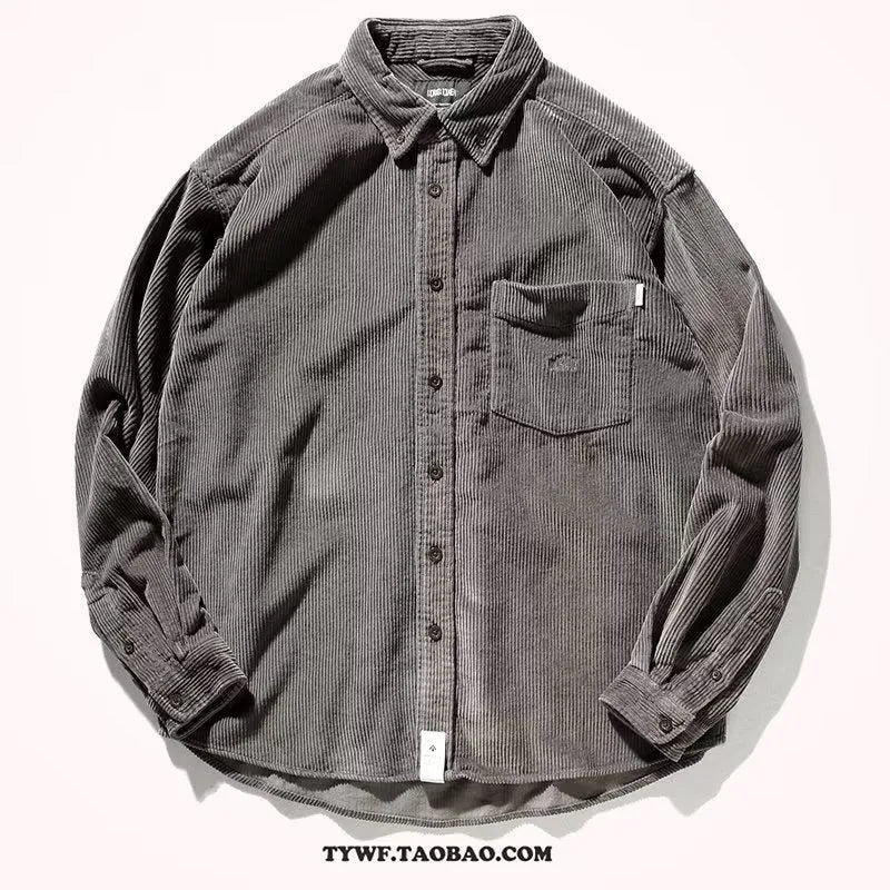 A caramel-coloured loose-fit corduroy long sleeve shirt laid flat, showing its cardigan-style cut and textured fabric.