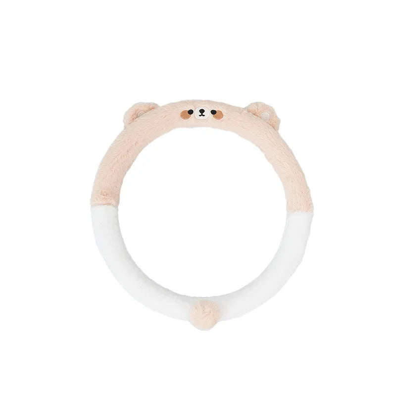 Plush steering wheel cover with embroidered animal design measuring 38cm in diameter