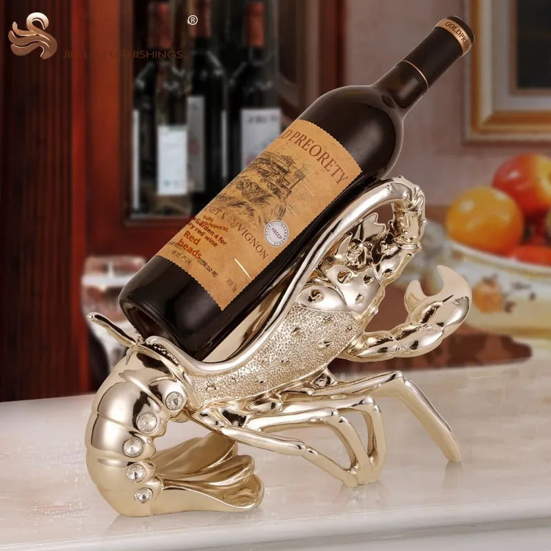 Lobster-shaped natural resin wine rack ornament in rose gold or silver colour on a table.
