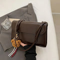 Brown women's PU Maillard handbag with pendant detail, horizontal square shape, and double shoulder straps