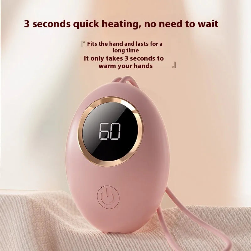 USB-powered hand warmer with digital display showing battery level and heat settings