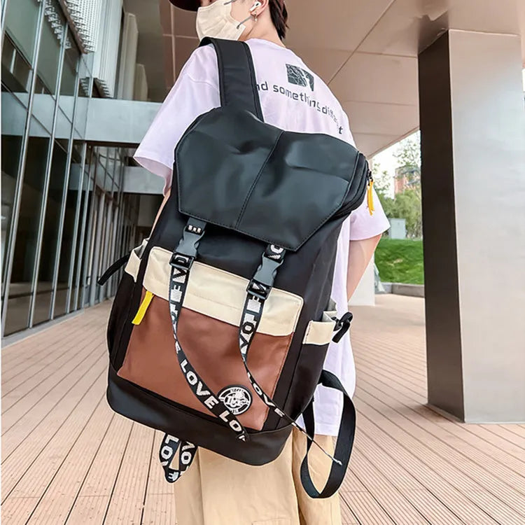 Oxford cloth backpack in black, green, or red with shoulder straps and 32cm by 46cm dimensions