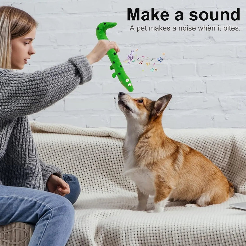 Green lizard-shaped dog chew toy with squeaker on a white background.