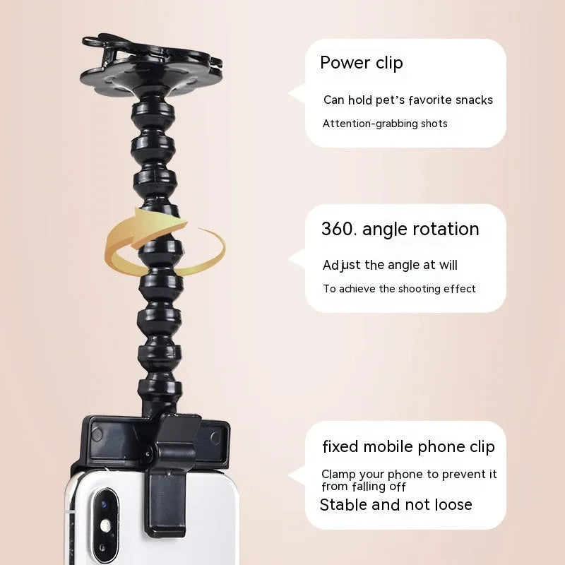 Black plastic pet photography clip tool holding mobile phone with snack grip attachment