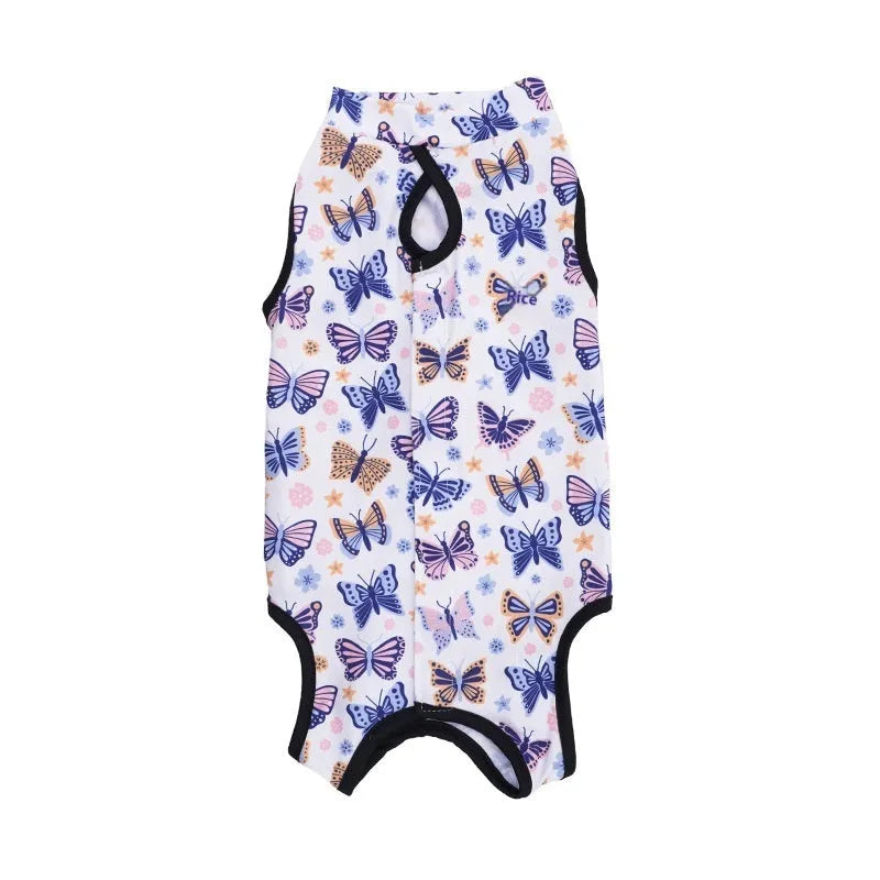 Cat wearing a patterned polyester sterilisation recovery suit with Velcro fastening on its side.