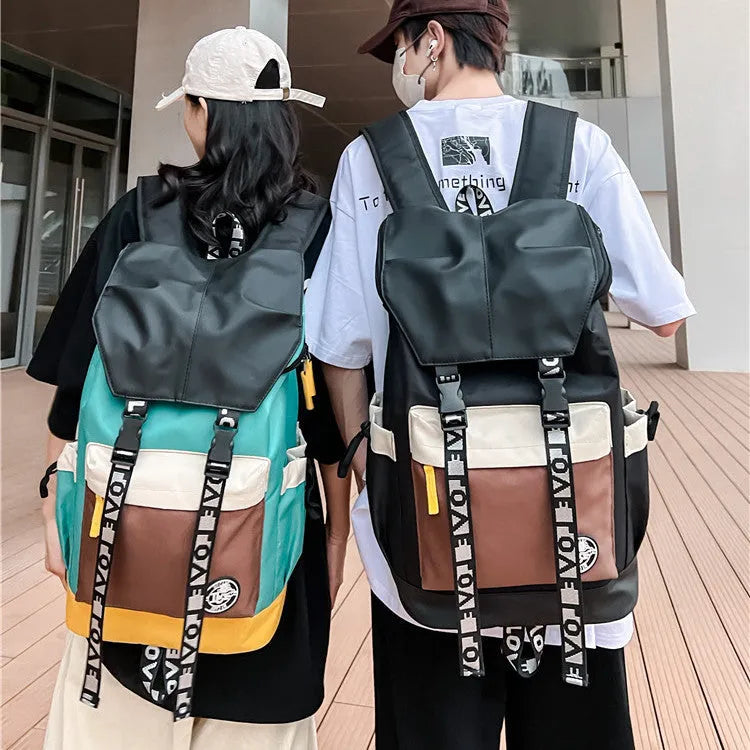Oxford cloth backpack in black, green, or red with shoulder straps and 32cm by 46cm dimensions