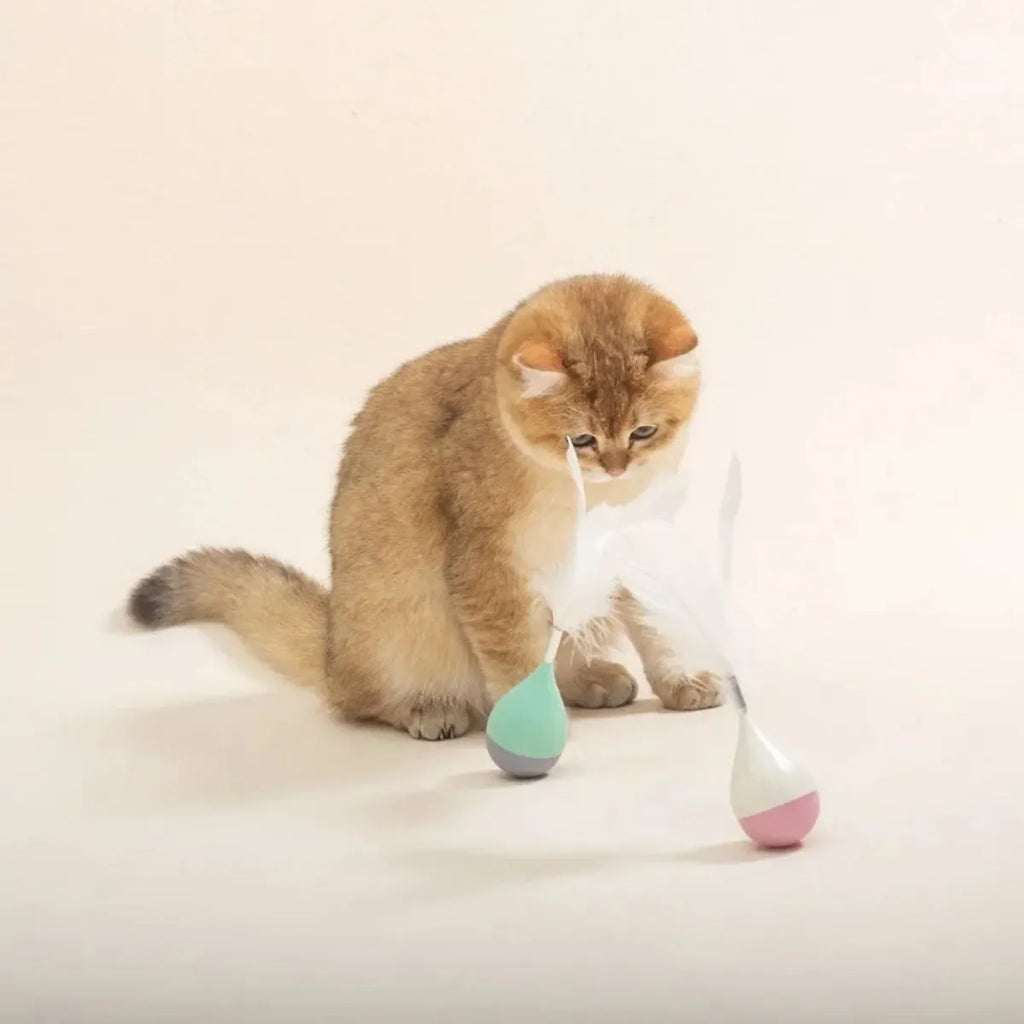 Green feather tumbler cat toy with attached tease stick and aluminium alloy components