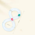 Blue and white interactive cat toy set with turntable track, ball, and teasing stick on floor