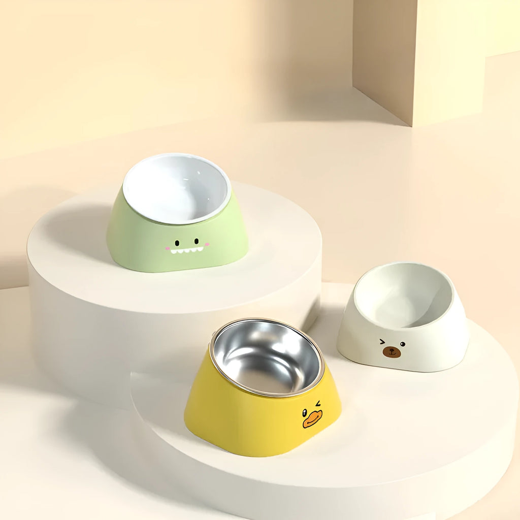 Green tilted stainless steel pet bowl showing 15-degree feeding angle
