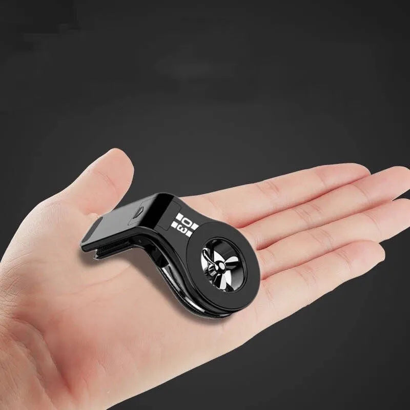 Magnetic car phone holder attached to vehicle air vent with phone mounted