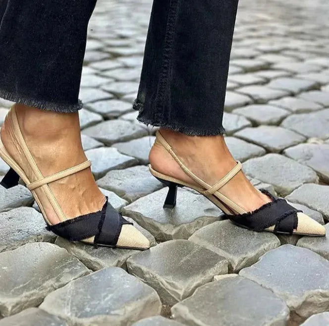 Apricot and black women's stiletto heel sandals with a pointed toe and buckle strap
