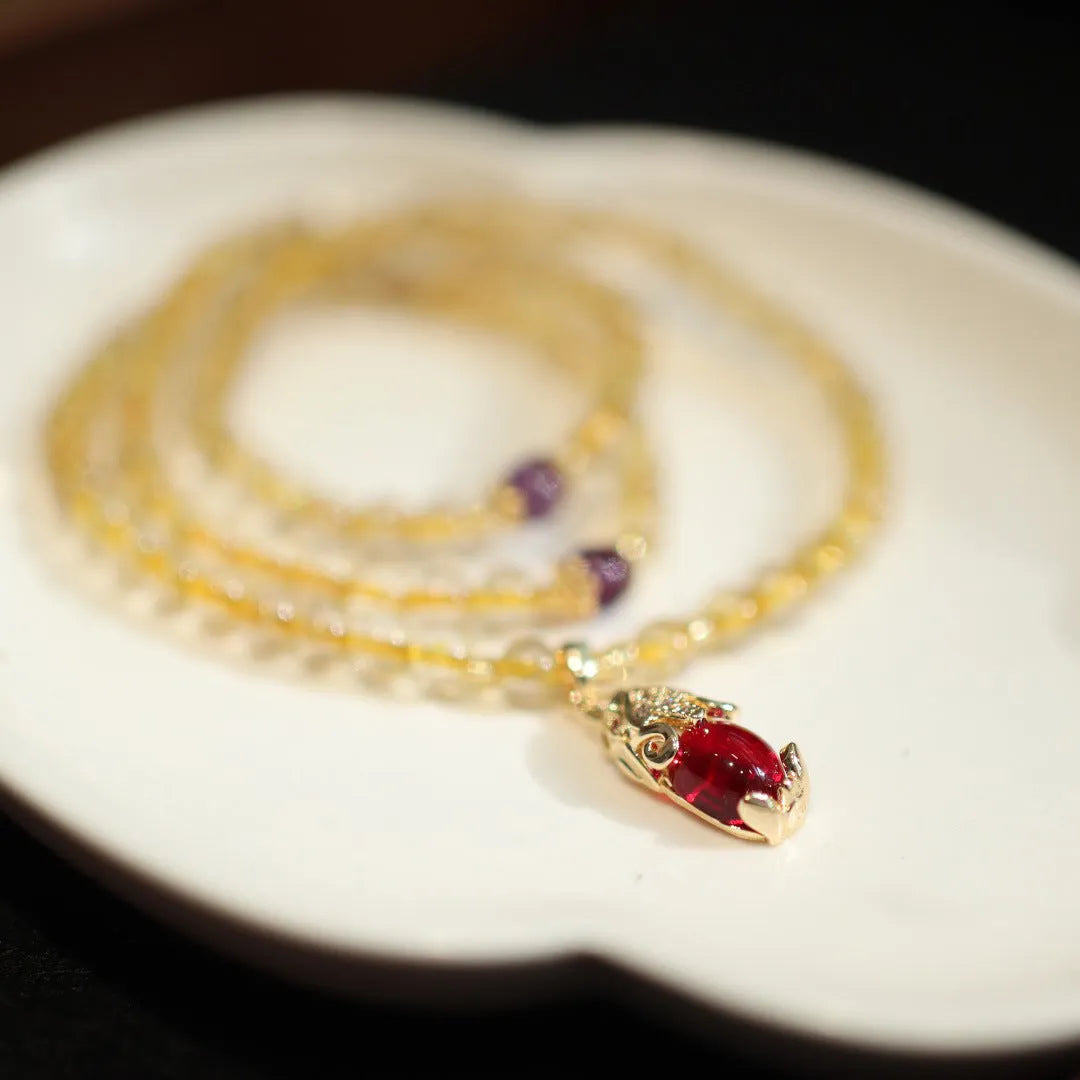 Natural gold rutilated quartz bracelet with hanging chopsticks design