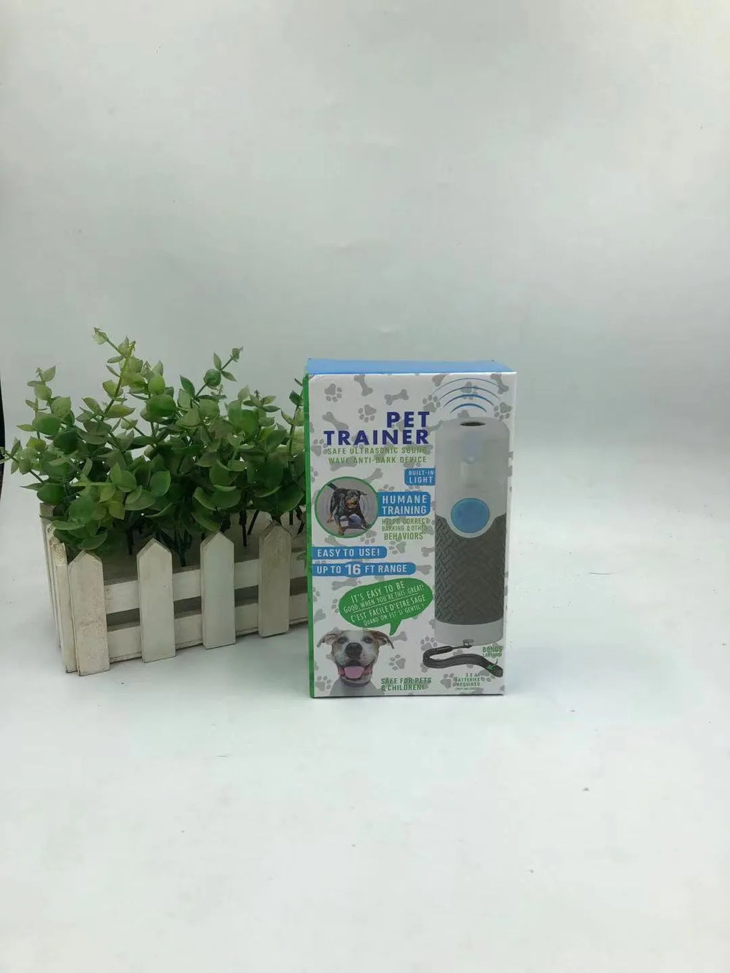 White handheld ultrasonic dog trainer for bark control and behaviour correction