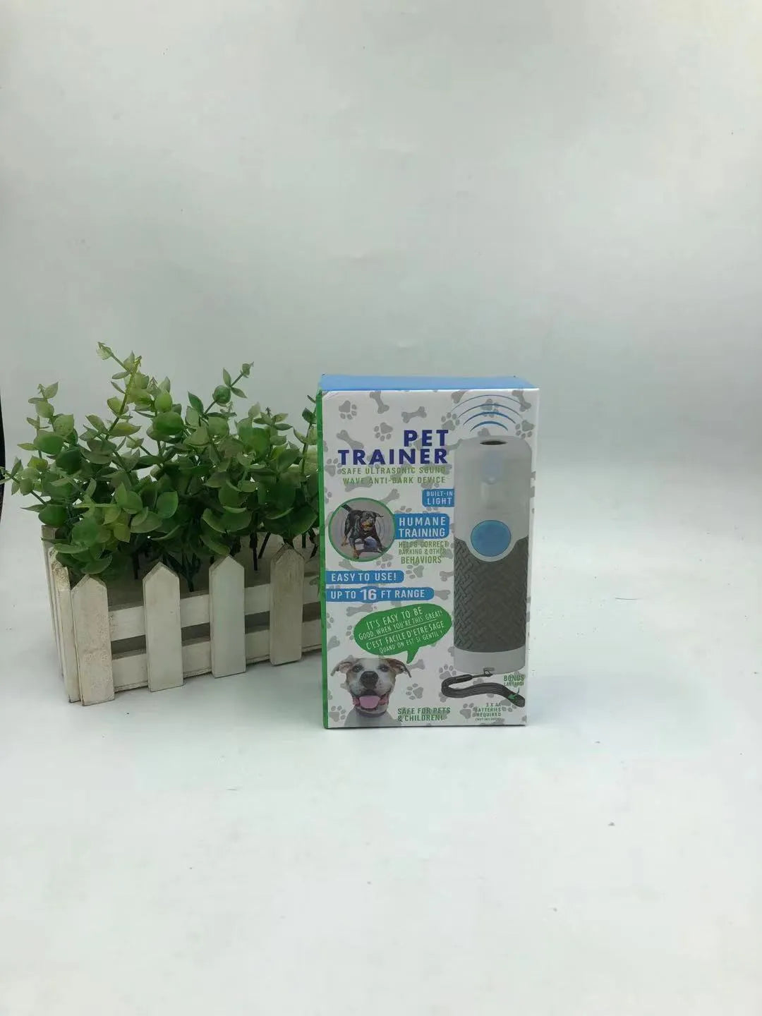 White handheld ultrasonic dog trainer for bark control and behaviour correction