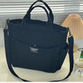 Canvas shoulder bag in khaki, 31cm wide, with handle and crossbody strap, urban simplicity style