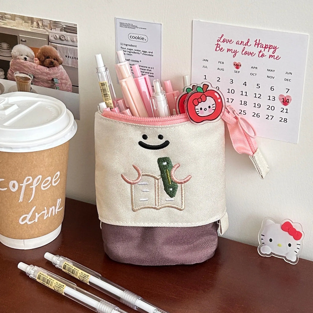 Brown and green collapsible cartoon pencil case made from Oxford fabric, shown with dimensions 17cm by 14cm.