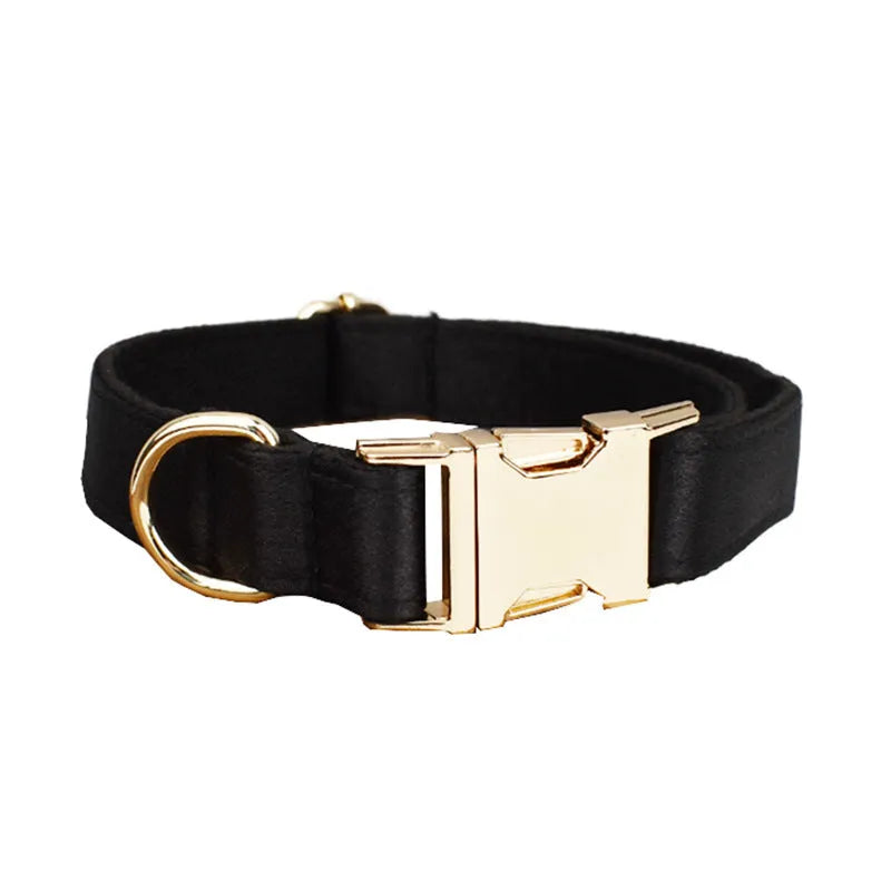 A complete cloth dog accessory set showing a collar, leash, chest strap, vest, and decorative bow in matching colours.