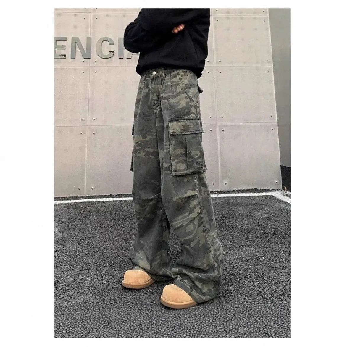 American vintage washed camouflage cotton blend cargo trousers with multiple pockets on a mid-rise waist.