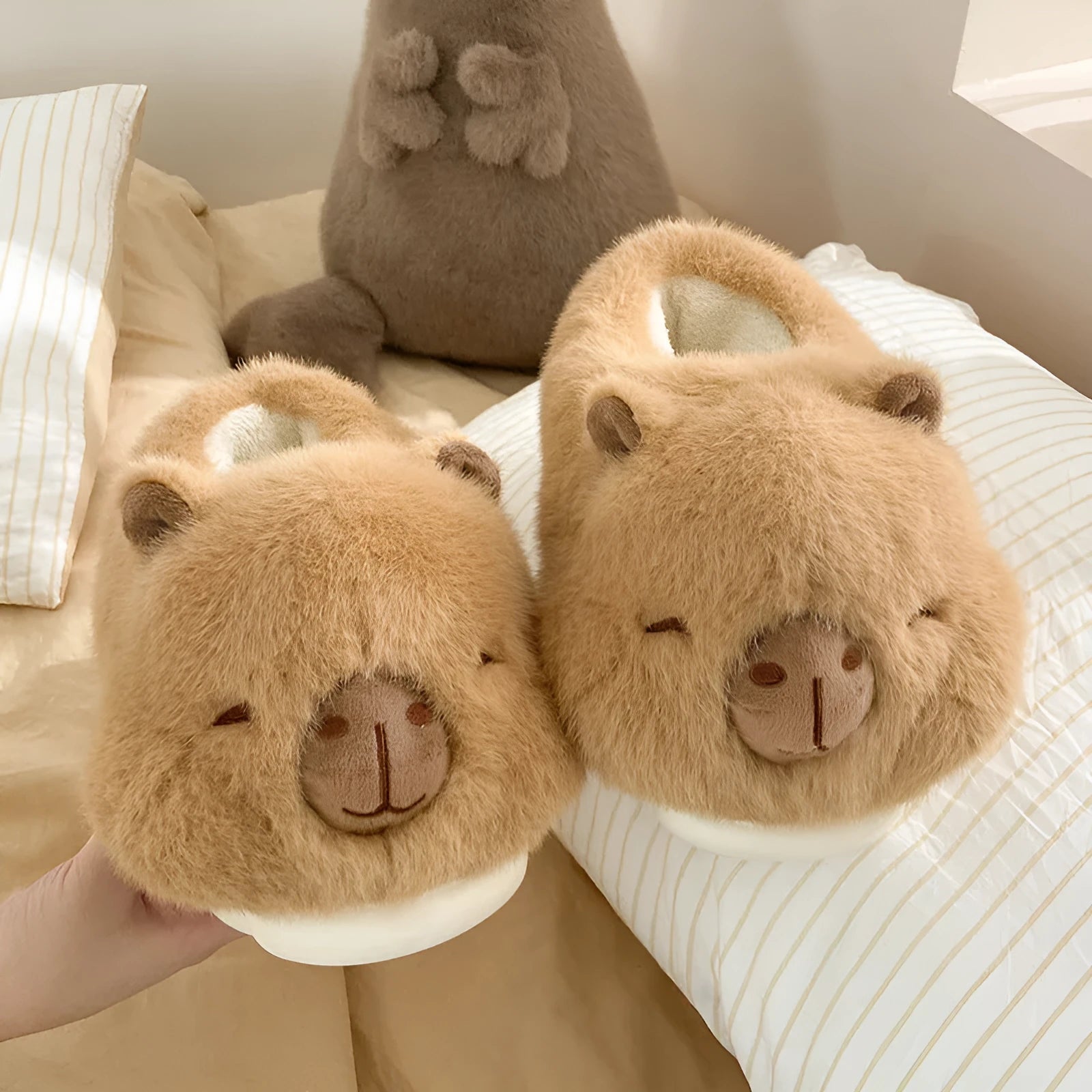 Light brown women's winter plush slippers with cartoon pattern and artificial wool lining.