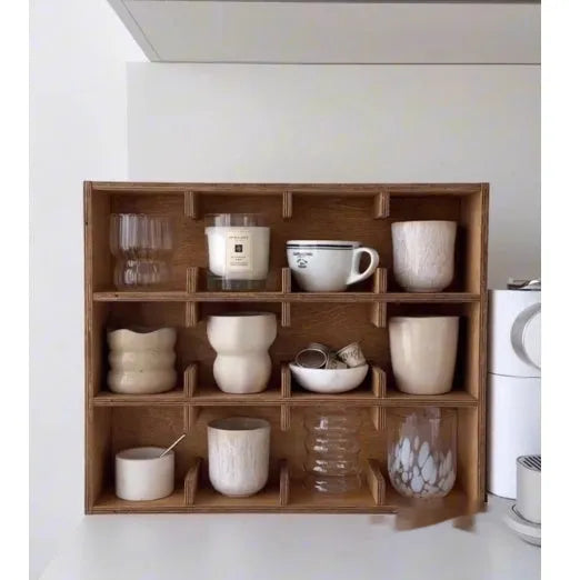 Square wooden storage rack with multiple grid compartments for cups in a birch wood finish.