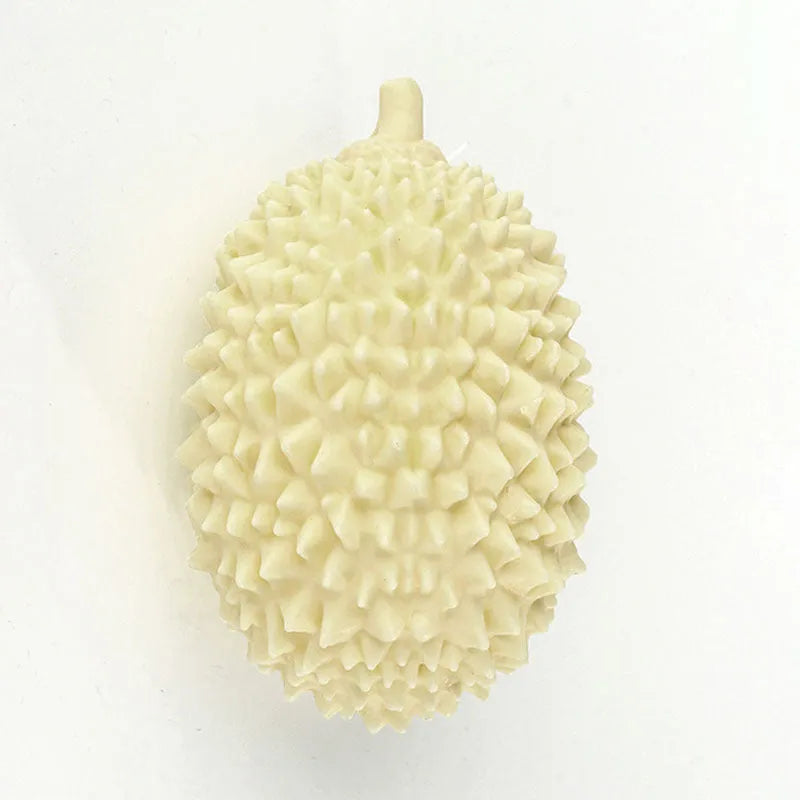 Durian-shaped milk-flavoured dog chew toy in beige with raised bumps for teeth cleaning and a bonus ball