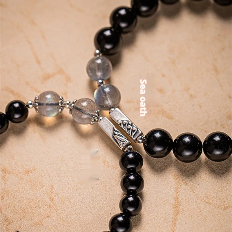 Obsidian Buddha beads couple bracelet set showing 8mm and 10mm bracelets in a national style.