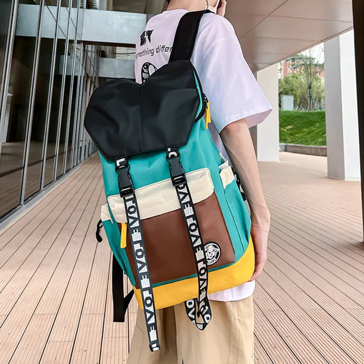 Oxford cloth backpack in black, green, or red with shoulder straps and 32cm by 46cm dimensions