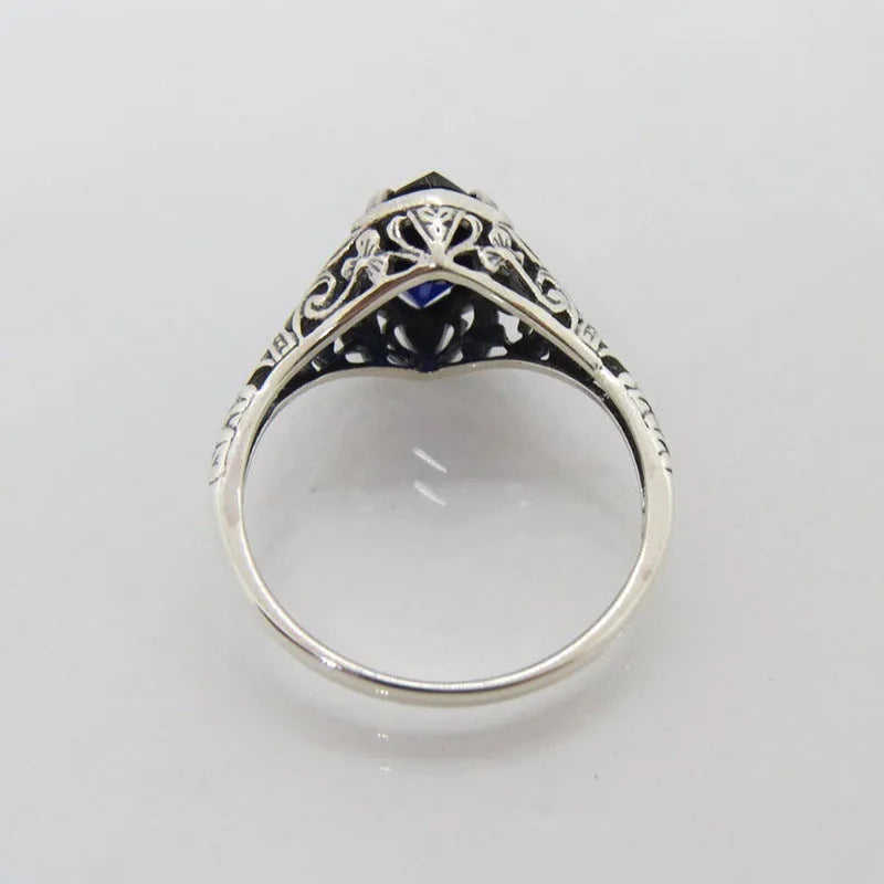 Silver geometric hollow women's ring shown in alloy with electroplated finish
