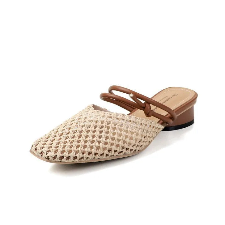 Women's black retro slippers with a square toe, chunky heel, and breathable hollow-out design on a rubber sole.