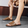 Men's brown and black leather sandals with a rubber sole, shown on a size guide from UK 38 to 48.