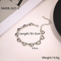 Stainless steel women's bracelet with hollowed-out heart design in gold or steel finish.