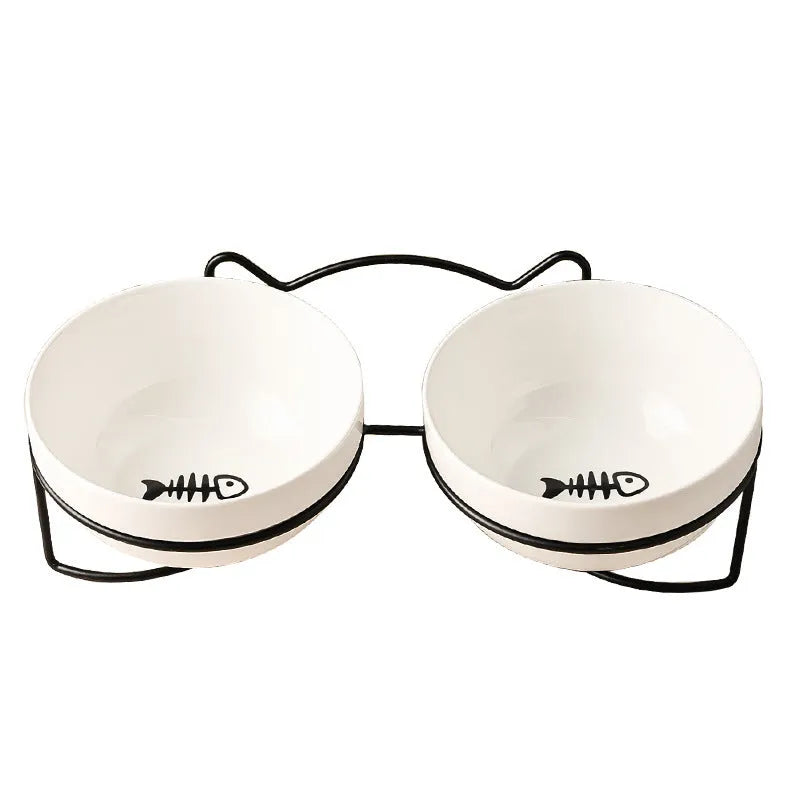 White ceramic cat bowl with iron frame in cat footprints design