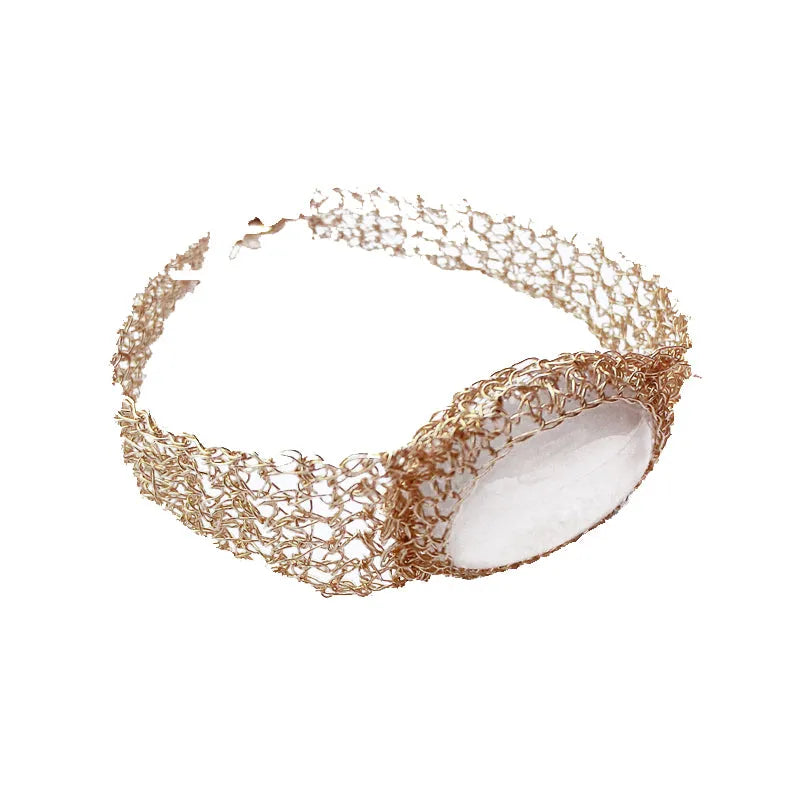 14k gold wire natural white chalcedony bracelet with adjustment chain on neutral background