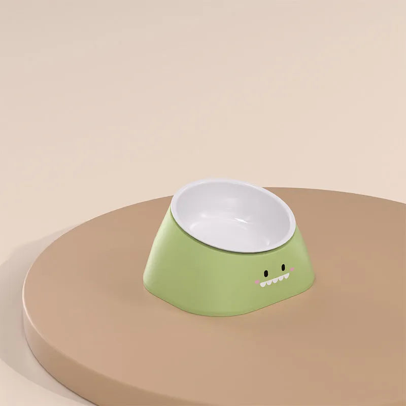 Green tilted stainless steel pet bowl showing 15-degree feeding angle