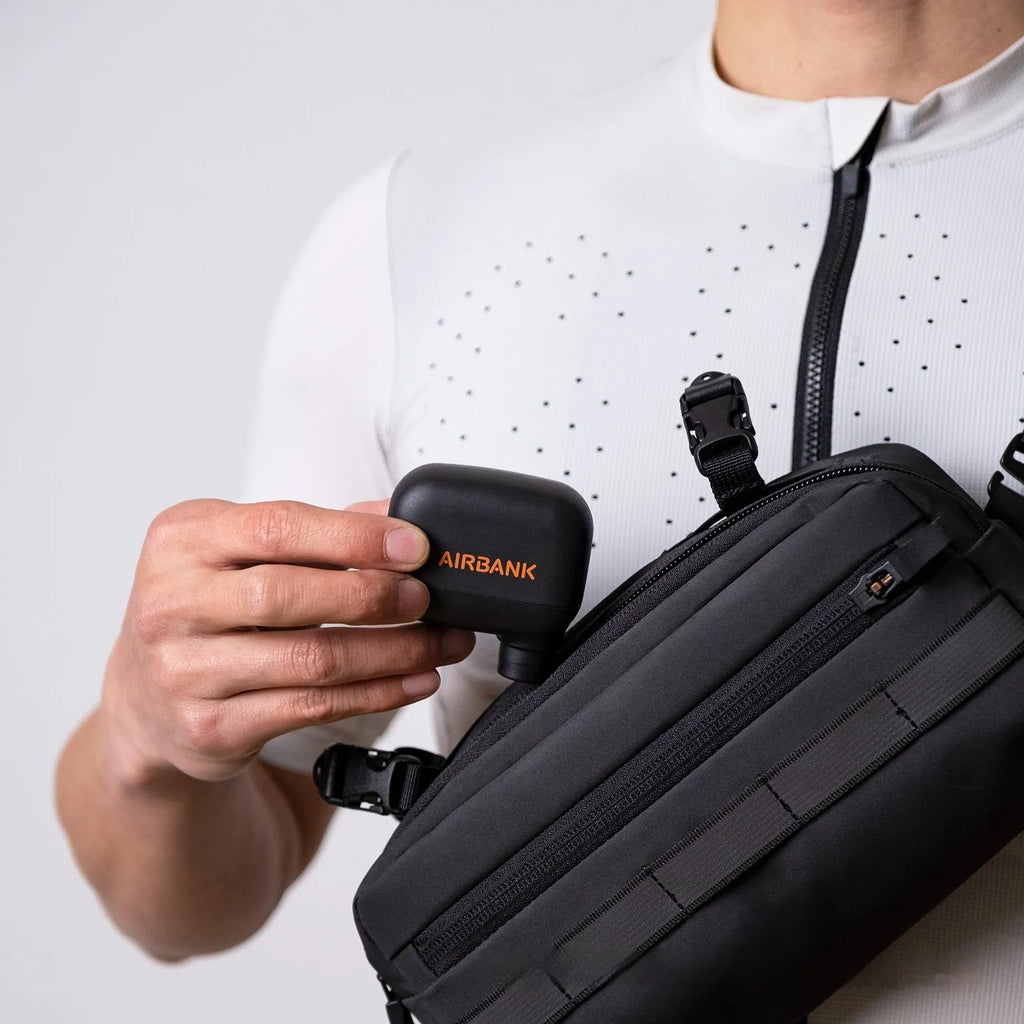 Black AS100 electric bicycle tyre inflator with USB cable and waterproof bag