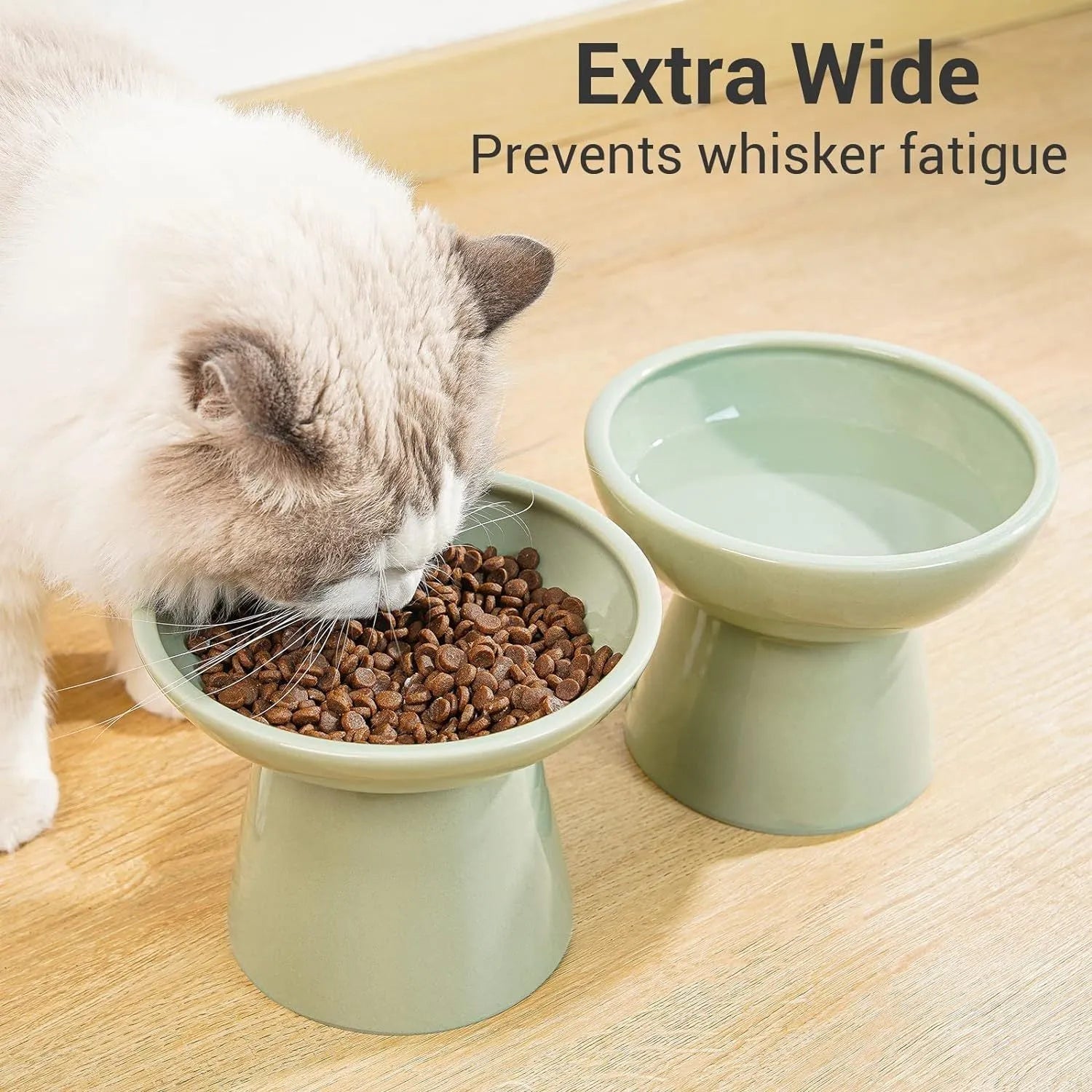 Blue ceramic elevated cat food bowl with wide shallow dish for whisker fatigue prevention.