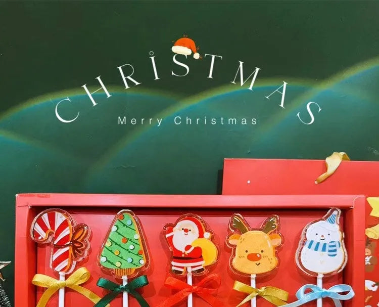 Pack of 5 Santa Claus shaped candies, 100g total net content, on a festive background