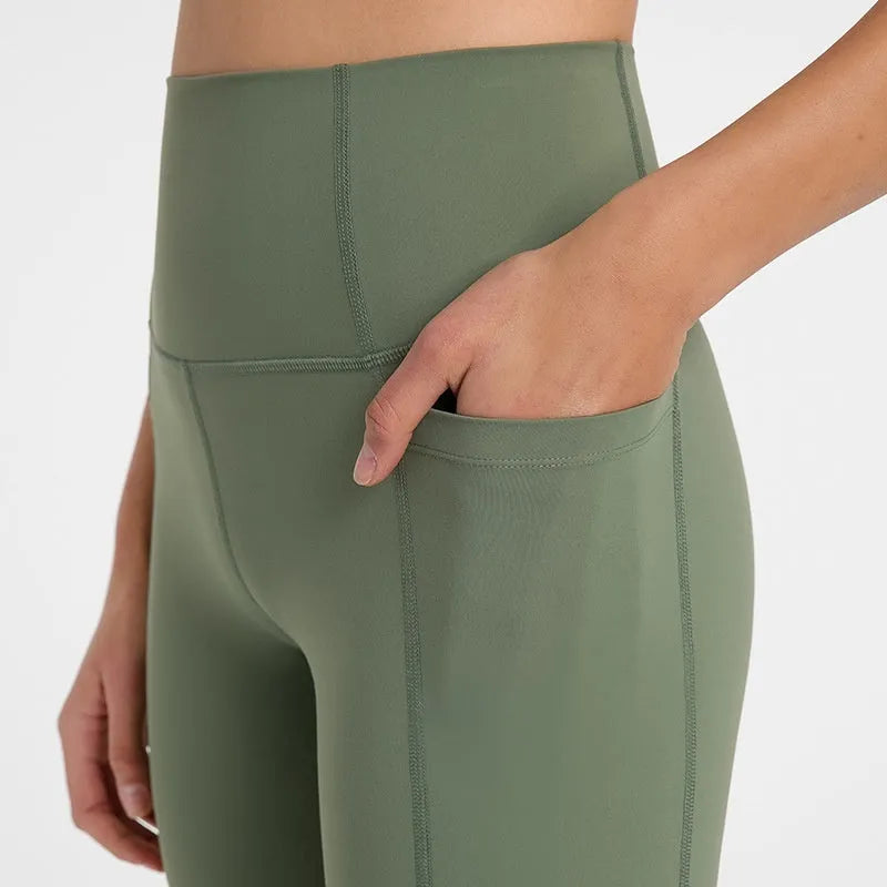 Women's tight-fit cotton blend sports shorts in light purple lotus colour, showing short fifth pants length.