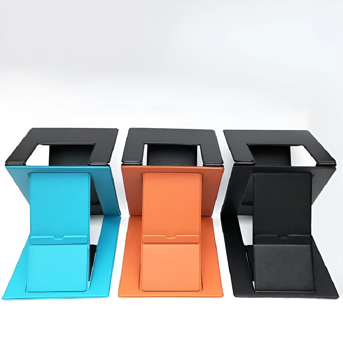 Folding multi-angle adjustable laptop stand in black, blue, and orange on a desk