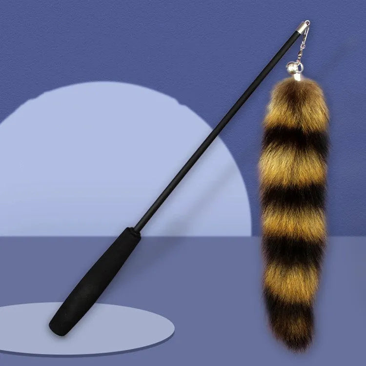 Black cat toy wand with feather attachment and elastic string for interactive play