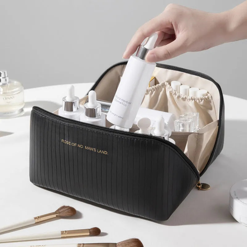 Vertical pattern pillow makeup bag with cubic shape measuring 22.5cm in PU material
