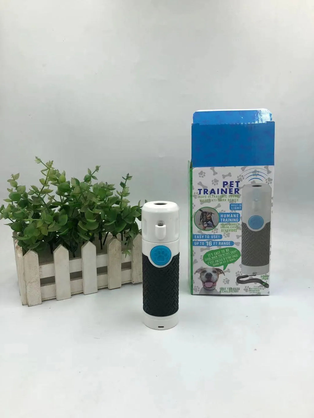 White handheld ultrasonic dog trainer for bark control and behaviour correction