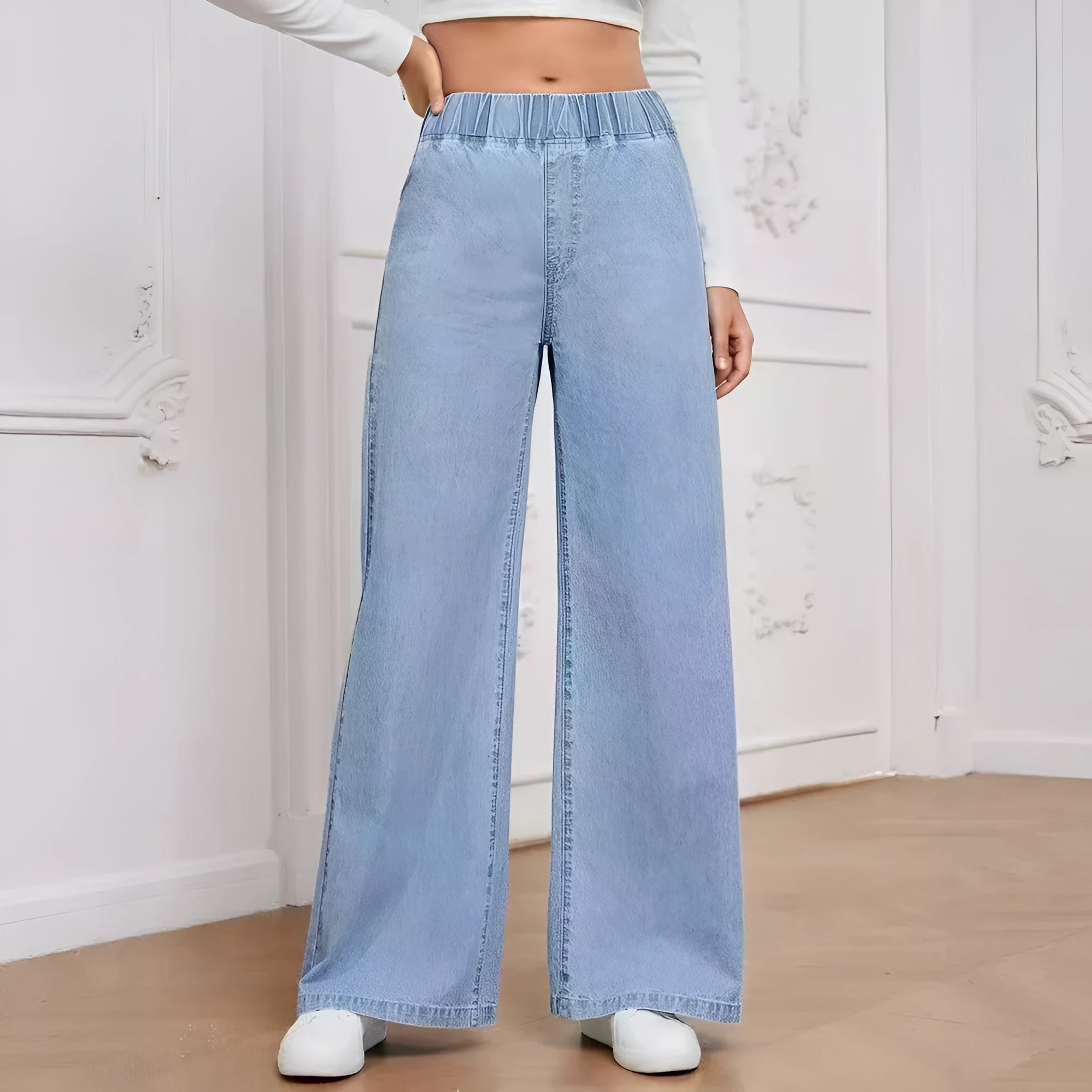 Light blue washed wide-leg plus size jeans with straight-leg design and zip fly
