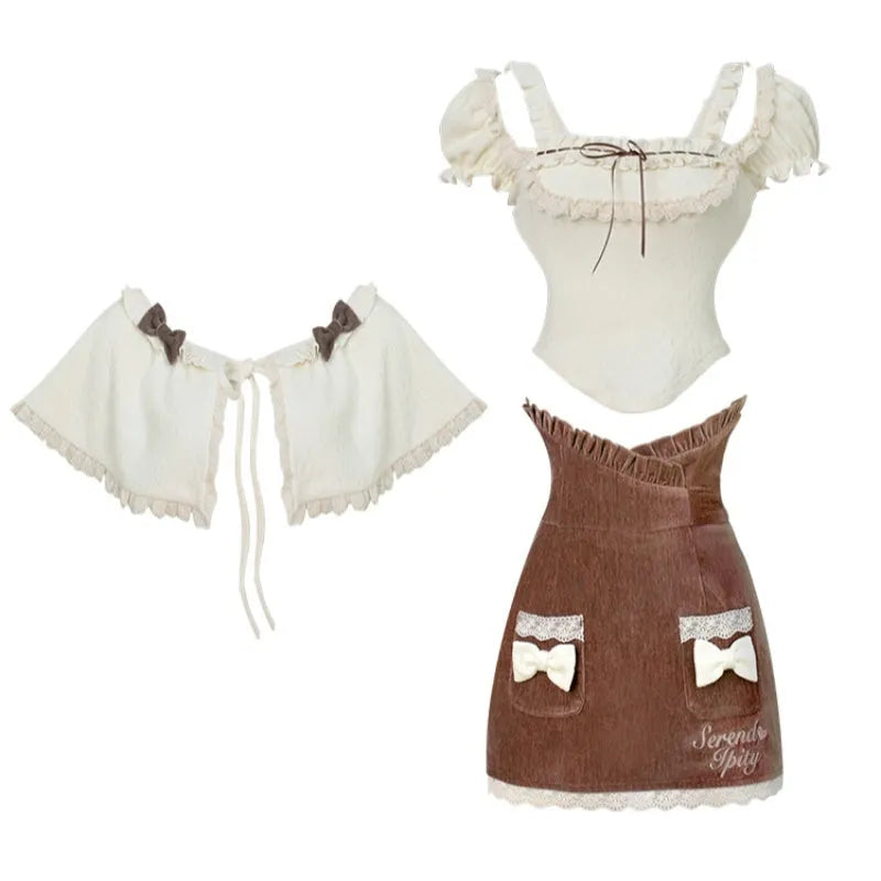 Apricot knitted top brown hip skirt and apricot shawl womens three-piece set on model