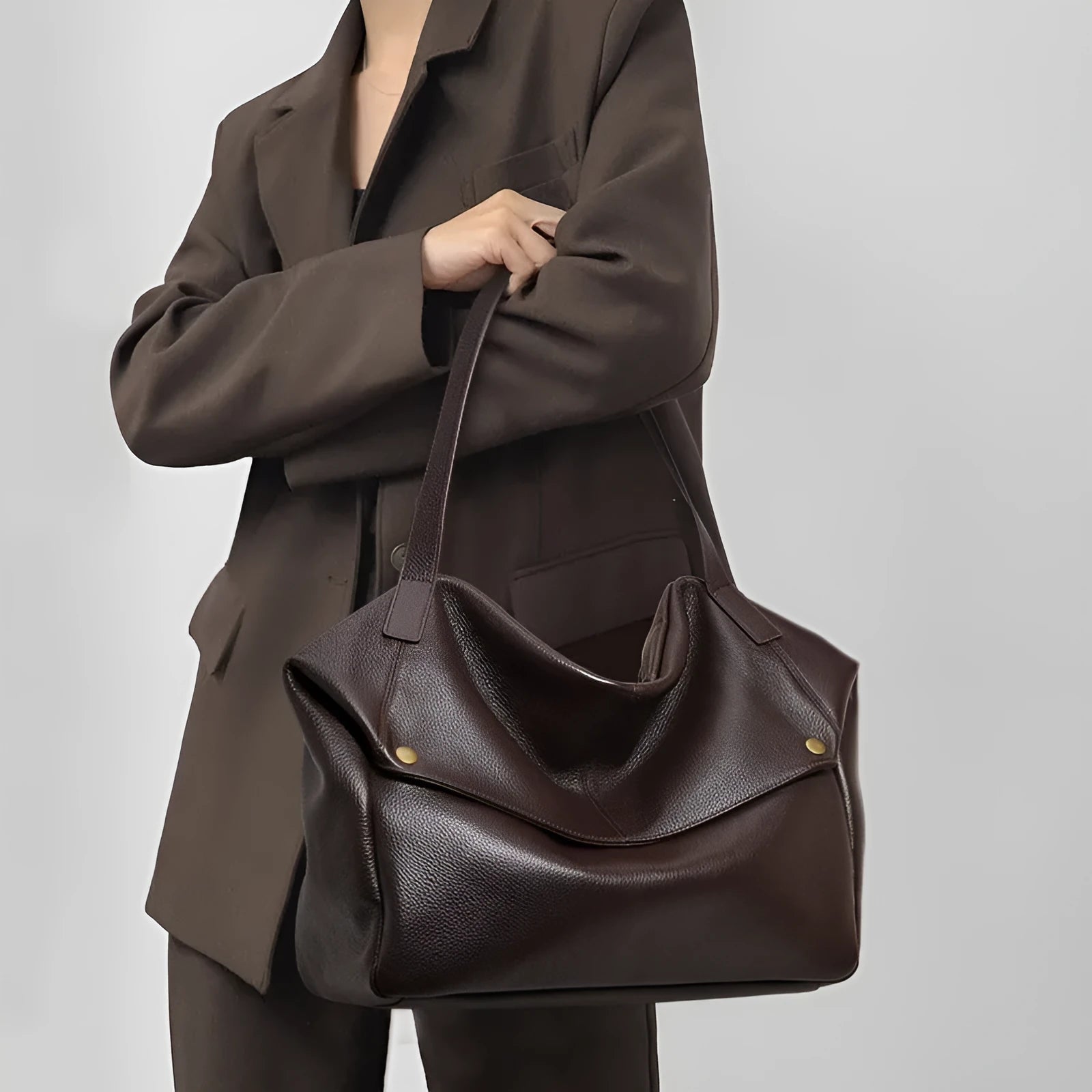 Brown genuine leather women's commuter shoulder bag showing horizontal square design