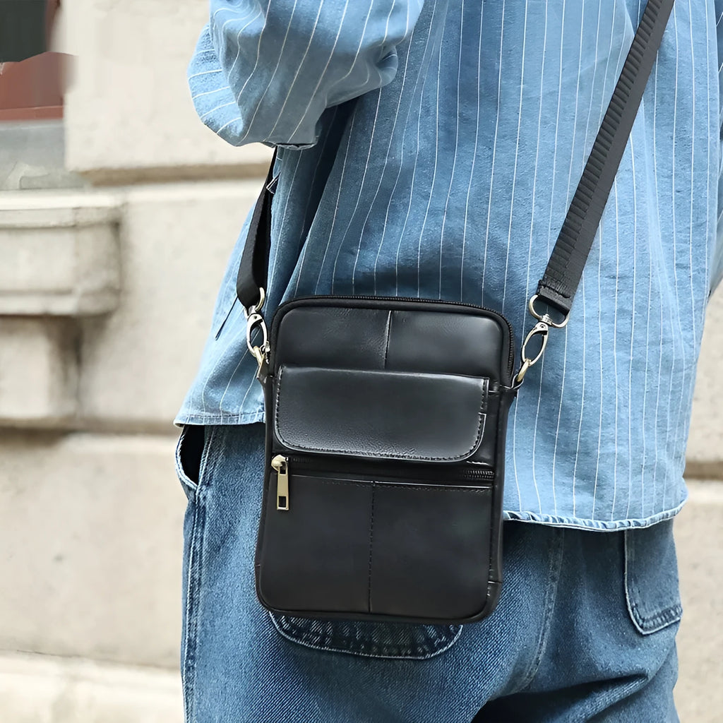 Men's brown leather crossbody shoulder bag with visible sewing detail