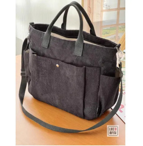 Canvas shoulder bag in khaki, 31cm wide, with handle and crossbody strap, urban simplicity style