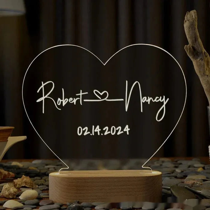 Personalised acrylic night light with engraved names and dates, measuring 20cm by 11.5cm